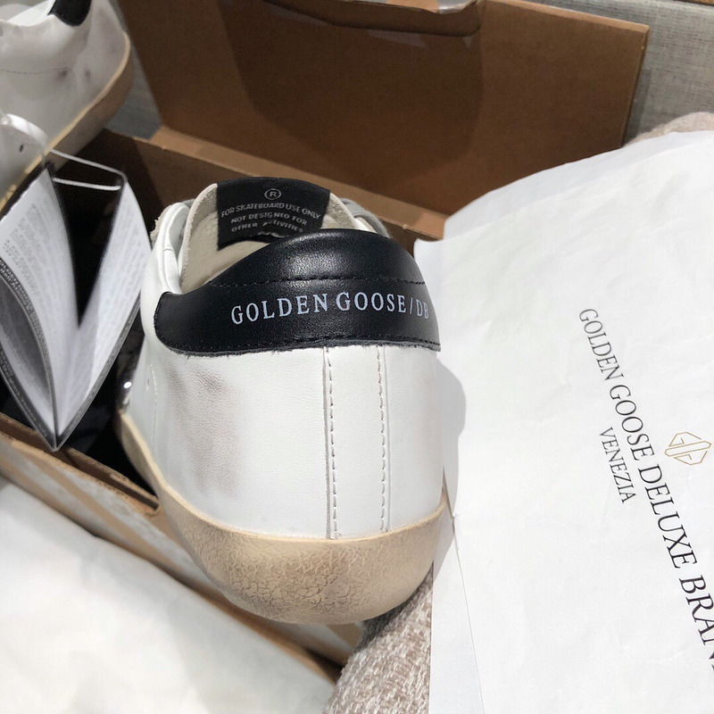 golden goose men’s S*per-star sneakers with silver star and black heel tab