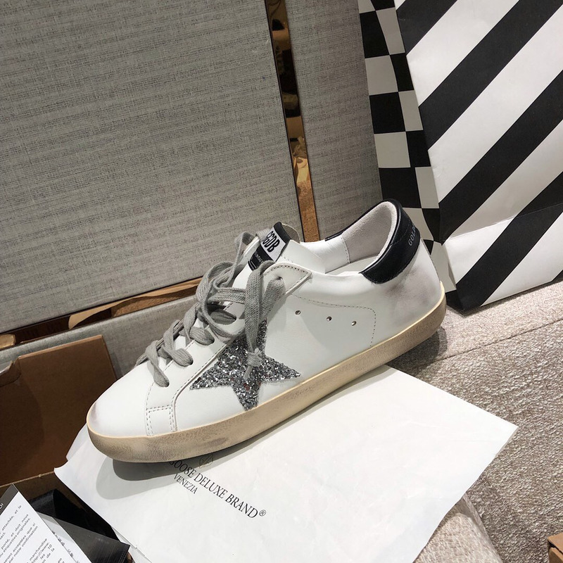 golden goose men’s S*per-star sneakers with silver star and black heel tab