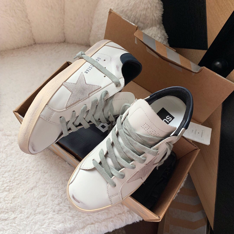 golden goose men’s S*per-star sneakers with suede star and blue heel tab