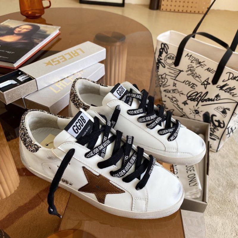 golden goose men’s S*per-star sneakers with brown suede star and glitter heel tab