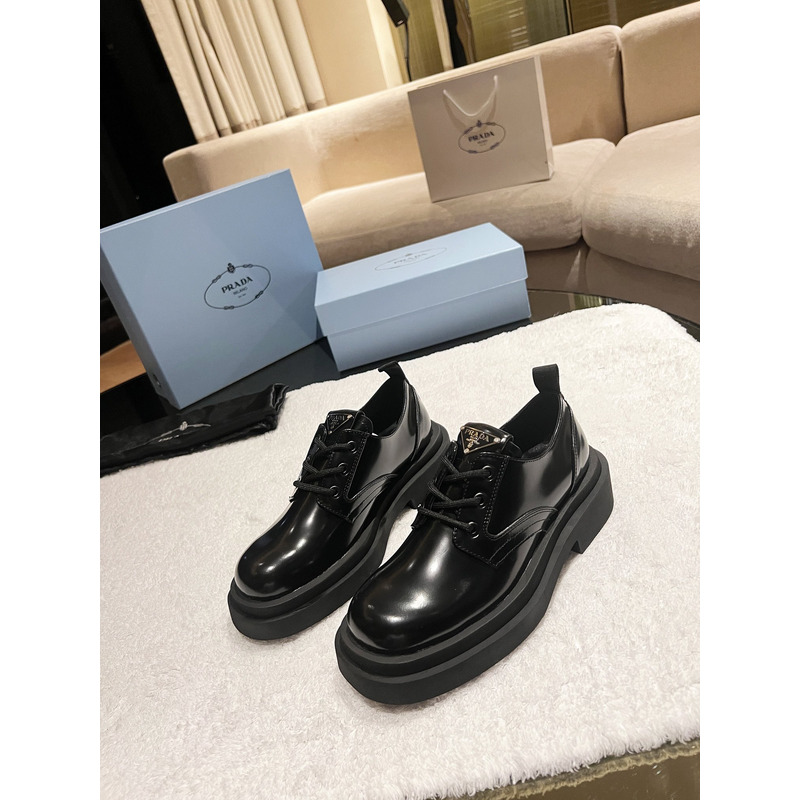 Pra*a triangle-logo brushed leather derby shoes black