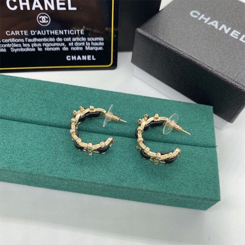 Ch*el metal and calfskin crystal earrings